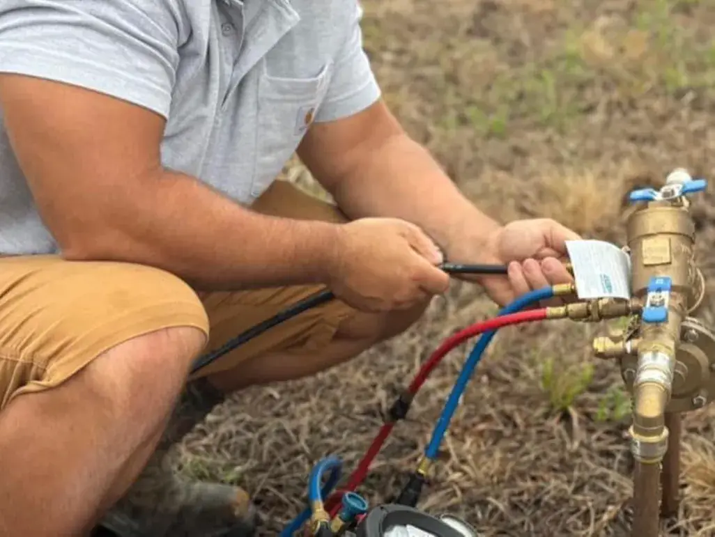 Backflow preventer being installed on a water line