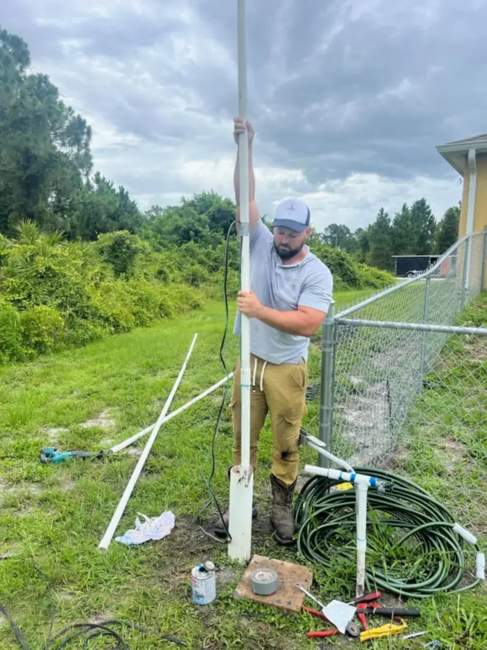 Michael of Crowebird Plumbing working on an outdoor line in Southwest Florida