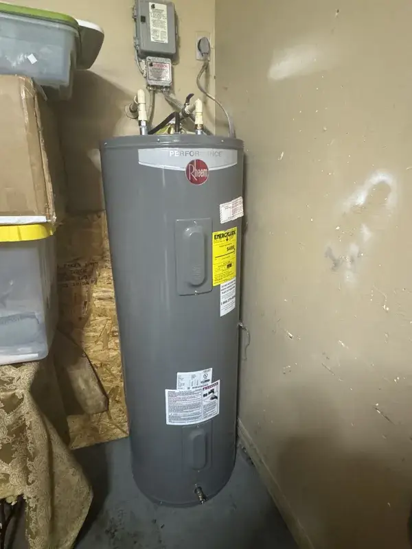 Rheem tank water heater installed in a utility area of a Southwest Florida home